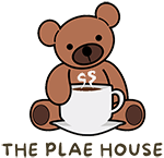 The Plae House — teddy bear holding a cup of coffee